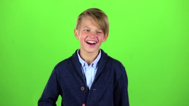 Boy little the guy smiles. Green screen. Slow motion — Stock Video