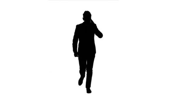 Guy rushes to him the phone rings, he starts talking and running. White background. Silhouette — Stock Video