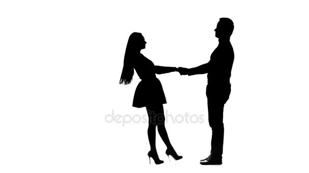 Guy takes the girl in his arms and kisses. Silhouette. White background — Stock Video