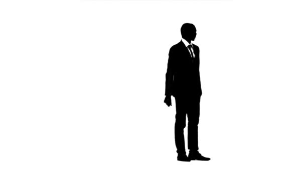 Man looks around and looks for something. White background. Silhouette — Stock Video