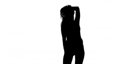 Striptizci ile vücudun cinsel hareketler yapar. Siluet. Beyaz arka plan. Ağır çekim