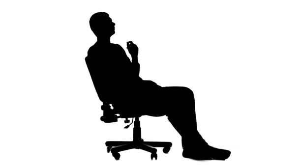 Bir depresyon bir sandalyede oturan adam. Siluet. Beyaz arka plan — Stok video