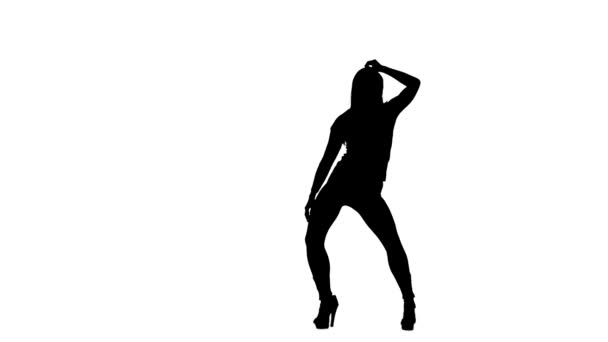 Fille se déplace gracieusement à la caméra. Silhouette. Fond blanc. Mouvement lent 