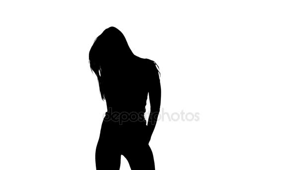 Mädchen zappelt sexuell an ihrem Körper. Silhouette. weißer Hintergrund. Zeitlupe — Stockvideo