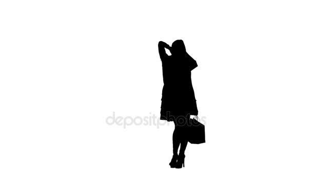 Girl was shopping at the store. Silhouette. White background. Slow motion — Stock Video