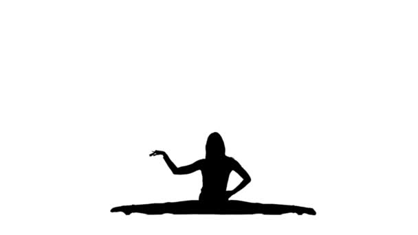 La gimnasta se sienta sobre un cordel. Silueta. Fondo blanco. Movimiento lento — Vídeo de stock