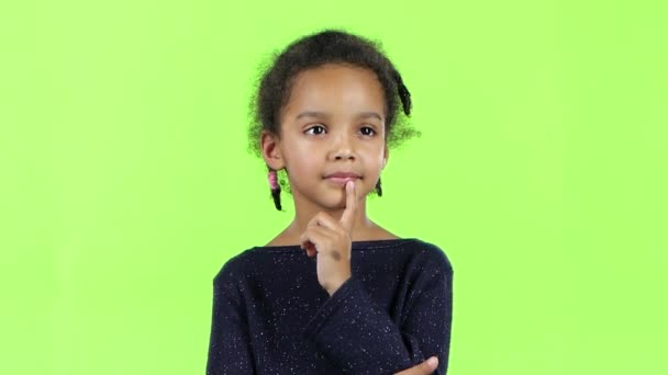 Baby thinks and an idea comes into her head. Green screen. Slow motion — Stock Video