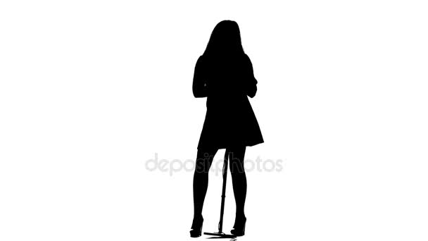 Girl sings lyrical songs and dances. White background. Silhouette — Stock Video