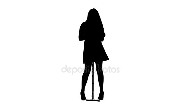 Girl sings lyrical songs and dances. White background. Silhouette. Slow motion — Stock Video