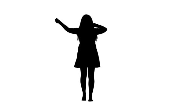 Vrouw is energiek, dansen met plezier. Witte achtergrond. Silhouet. Slow motion — Stockvideo