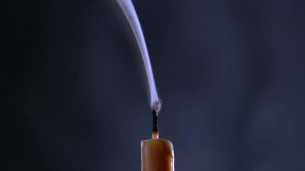 Candle is on and goes out. Black background. Close up — Stock Video