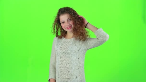 Model of the child poses for the cameras and sends air kisses. Green screen — Stock Video