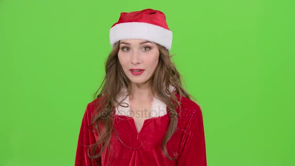 Girl in the red suit of the snow maiden scolds and points her finger a little more quietly. Green screen. Close up — Stock Video