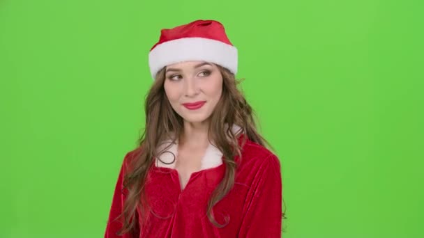 サンタ女性 thrumb 表示されます。背景のボケ味。緑色の画面。クローズ アップ — ストック動画