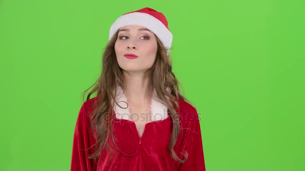 Girl in the red suit of the snow maiden winks and shows her finger ok. Green screen. Close up — Stock Video