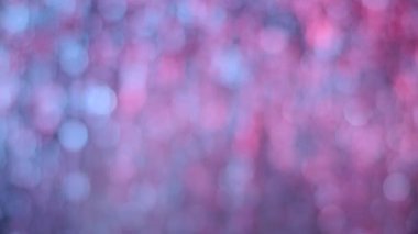 Pembe ve mavi bokeh ışıkları hareket. Arka plan aydınlatma