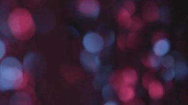 Pembe ve mavi bokeh ışıkları hareket. Arka plan aydınlatma
