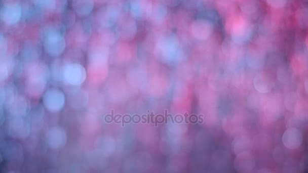 Feux bokeh roses et bleus en mouvement. Éclairage de fond 