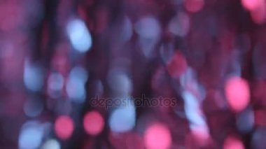 Hareketli parçacıklar renkli bokeh ışıklar arka plan bulanık