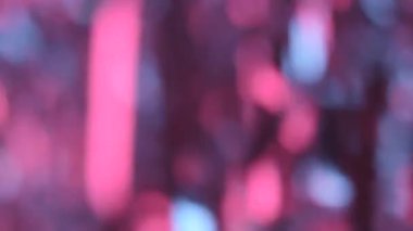 Soyut parçacık tinsel yumuşak kızdırma mavi çizgili pembe renk. Arka plan bokeh