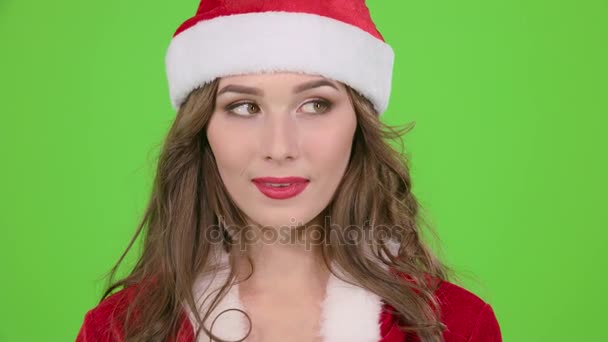 Girl in the red suit of the snow maiden scolds and points her finger a little more quietly. Green screen. Close up. Slow motion — Stock Video