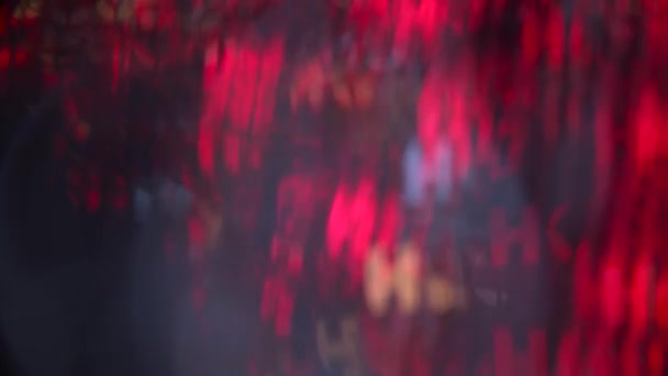 Великі барвисті кола боке світиться напис Ho Ho Ho абстрактний рух фону — стокове відео