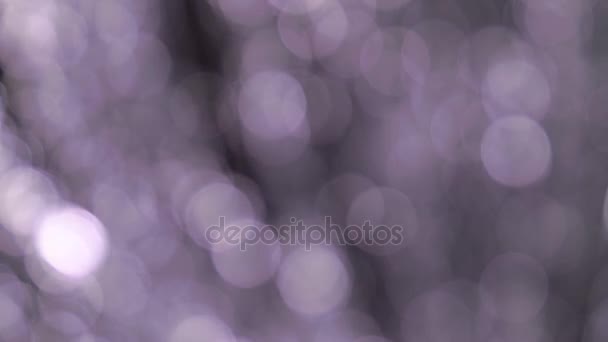 Luces brillantes grises contra un fondo bokeh — Vídeos de Stock