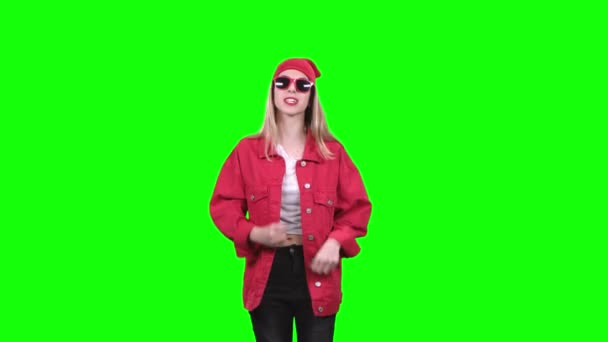 Girl in stylish clothes worries about the game of her team. Green screen. Slow motion — Stock Video