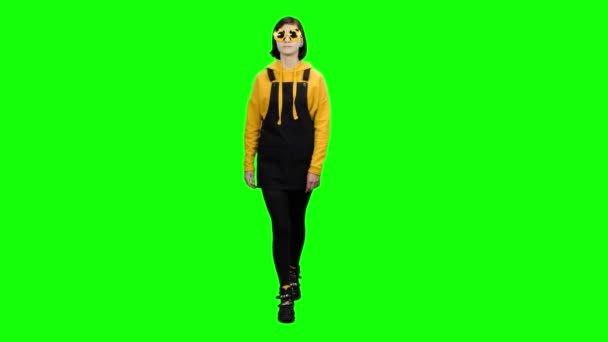 Teenager goes in funny glasses and fools around. Green screen — Stock Video