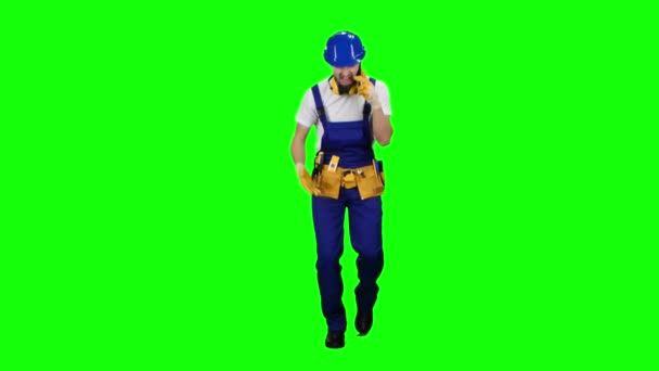 Builder speaks on the phone and screams at his subordinates. Green screen — Stock Video