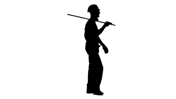 Engineer with a spirit level in his hands goes to the building measurements. White background. Silhouette. Side view — Stock Video