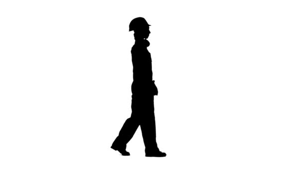 Worker girl comes with a hammer in her hands and in a helmet. Silhouette. White background. Side view — Stock Video