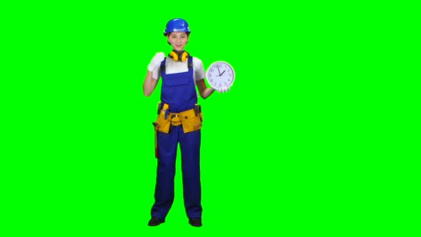 Brigadier girl is holding a large clock and showing okay. Green screen — Stock Video