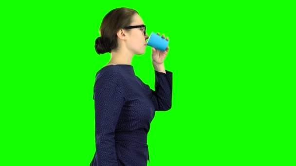 Teacher goes and drinks water from the glass. Green screen — Stock Video