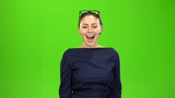 Woman is happy with the good news. Green screen — Stock Video