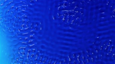 Su altında titreşim eylem grafiksel dokular oluşturur. Mavi arka plan. Ağır çekim