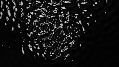 Titreşim nedeniyle oluşturan su yüzeyinde daire dans. Siyah arka plan. Ağır çekim