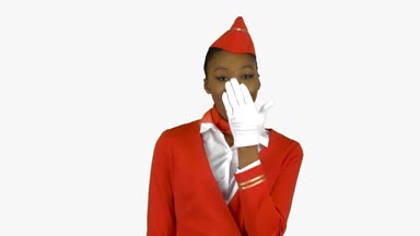 Afro-Amerikan hostes winks hafif bir flört bir AIR öpücük gönderir. Alfa kanalı