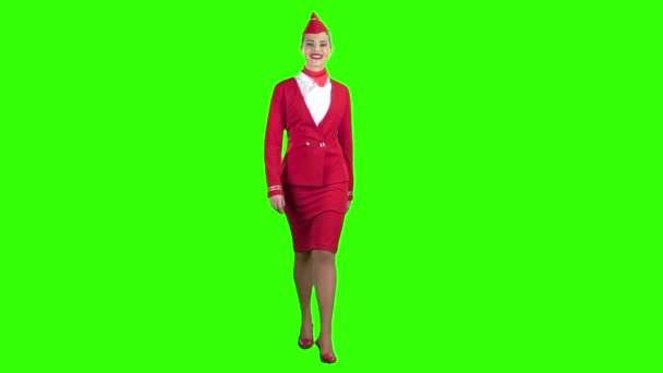 Stewardess megy, és üdvözli a körülötte lévők. Zöld képernyő. Lassú mozgás — Stock videók