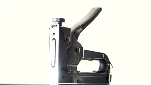 Construction hand-held stapler on white, rotation — Stock Video