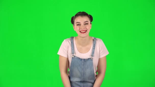 Girl cute laughing against green screen at studio — Stock Video