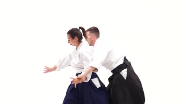 Atleta e mulher praticando aikido, isolado em branco . — Vídeo de Stock