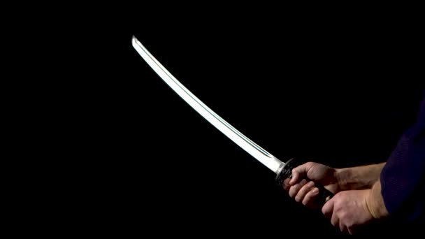 Japanese Katana Sword Blade Close Up On A Dark Background Stock Video C Kinomasterdnepr 326221698 japanese katana sword blade close up on a dark background