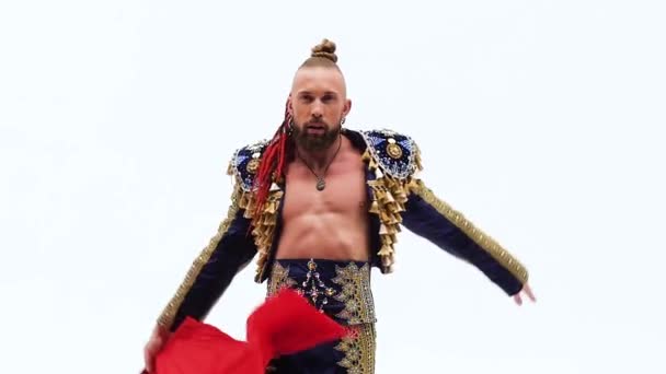 Torero in blue and gold suit or typical spanish bullfighter isolated over white studio background. Close up, slow motion. — Stock Video