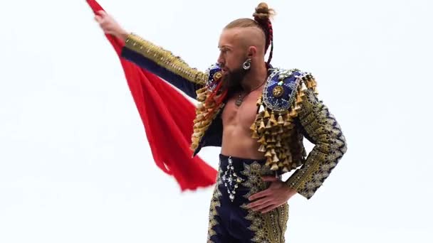 Torero in blue and gold suit or typical spanish bullfighter isolated over white studio background. Close up, slow motion. — 비디오