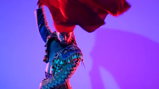 Torero in blue and gold suit or typical spanish bullfighter isolated over on a blue background. Close up, slow motion. — ストック動画