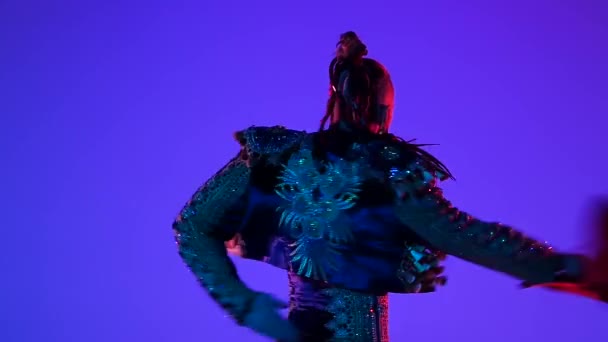 Torero in blue and gold suit or typical spanish bullfighter isolated over on a blue background. Close up, slow motion. — 비디오