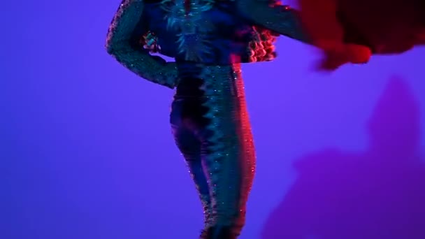 Torero in blue and gold suit or typical spanish bullfighter isolated over on a blue background. Close up, slow motion. — 비디오