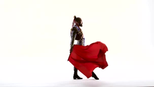 Torero in blue and gold suit or typical spanish bullfighter isolated over white studio background. Silhouette — Stock Video