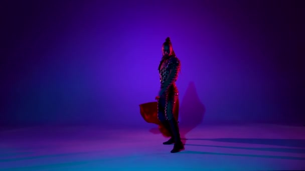 Torero in blue and gold suit or typical spanish bullfighter isolated over on a blue background. Close up, slow motion. — Stock Video